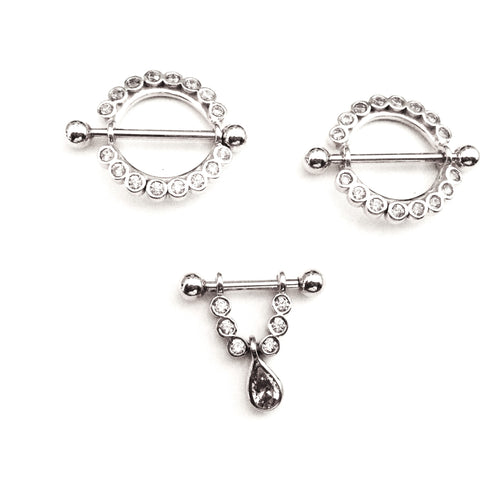 Goldene Brustwarzenpiercings / Nippelpiercings: Sonnen, Schilde und spezielle Barbells